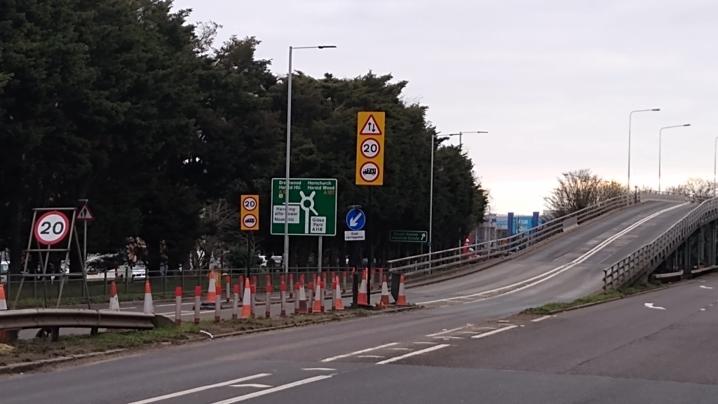 A view of an approach to the Gallows Corner flyover showing the weight and speed limits.